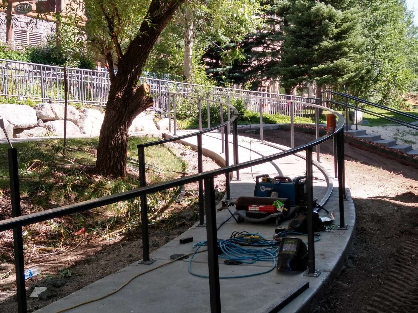 Rust Brothers crew welding a handrail on site
