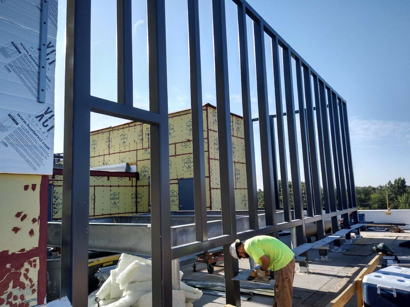 Certified welder fabricating structural steel railing in house